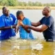 Baptizing a young man