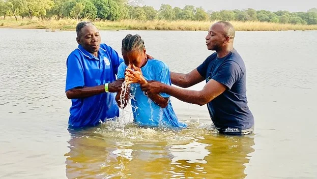 Baptizing a young man