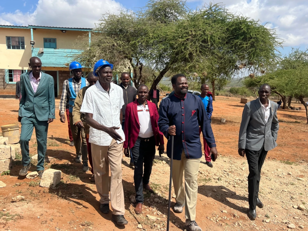Group of people talking and walking