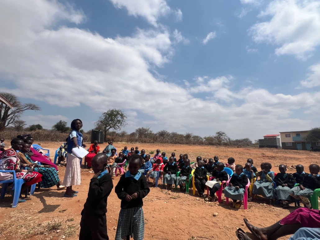 Group of children listen to a speaker