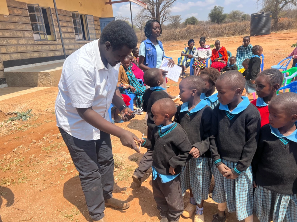 Children receiving pencils
