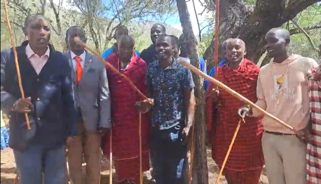 Church service, believers worshiping joyfully under a tree in Kenya