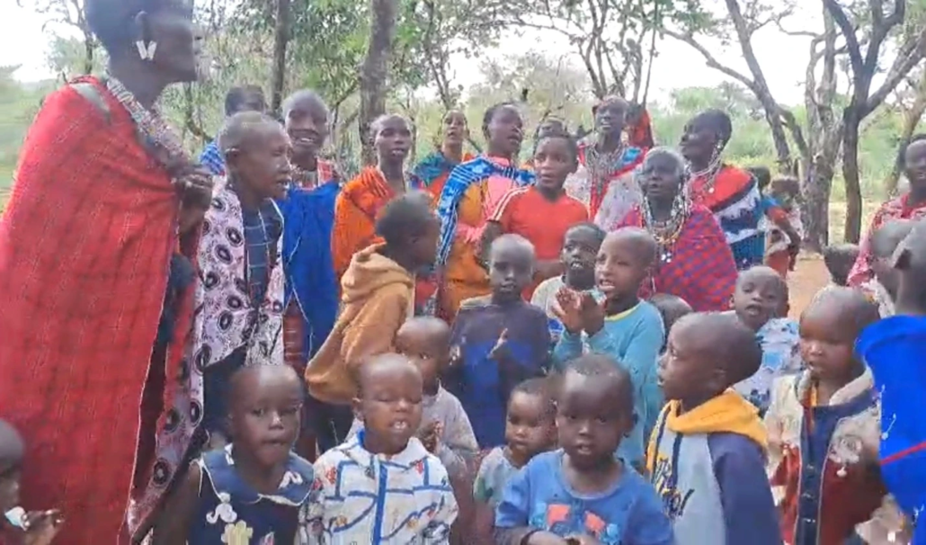 Church service, believers worshiping joyfully under a tree in Kenya