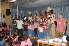 Praying and Dedicating KFLT donated books